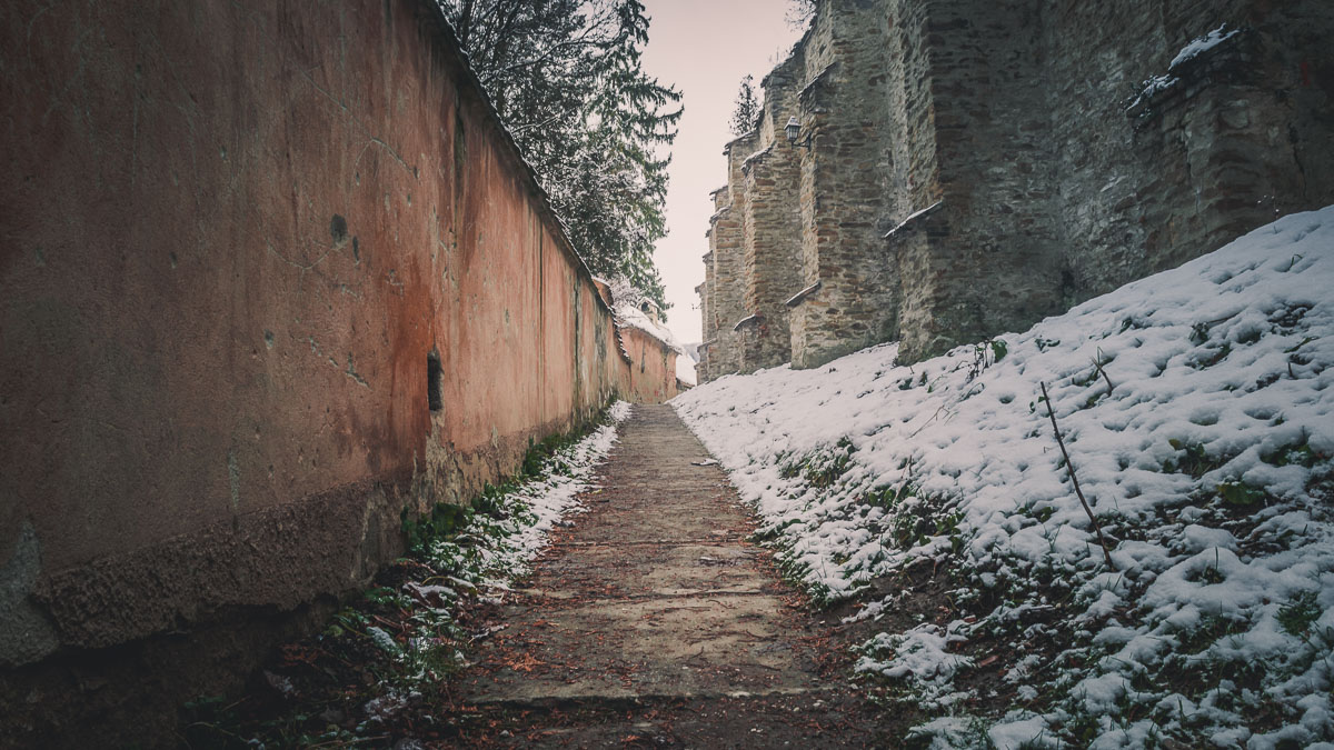 Alley next to the fortification walls of the fortified church.